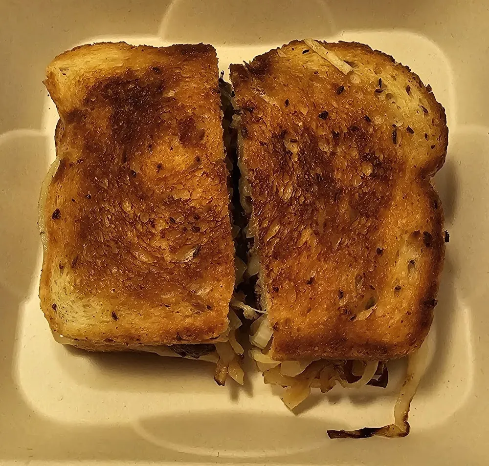Patty Melt Burger Comes with Pickles and a Side of Potato Chips